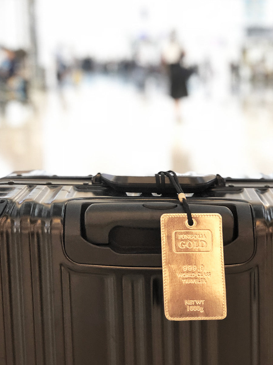 <A 000a001a99a1> Fungolia Gold Luggage Tag